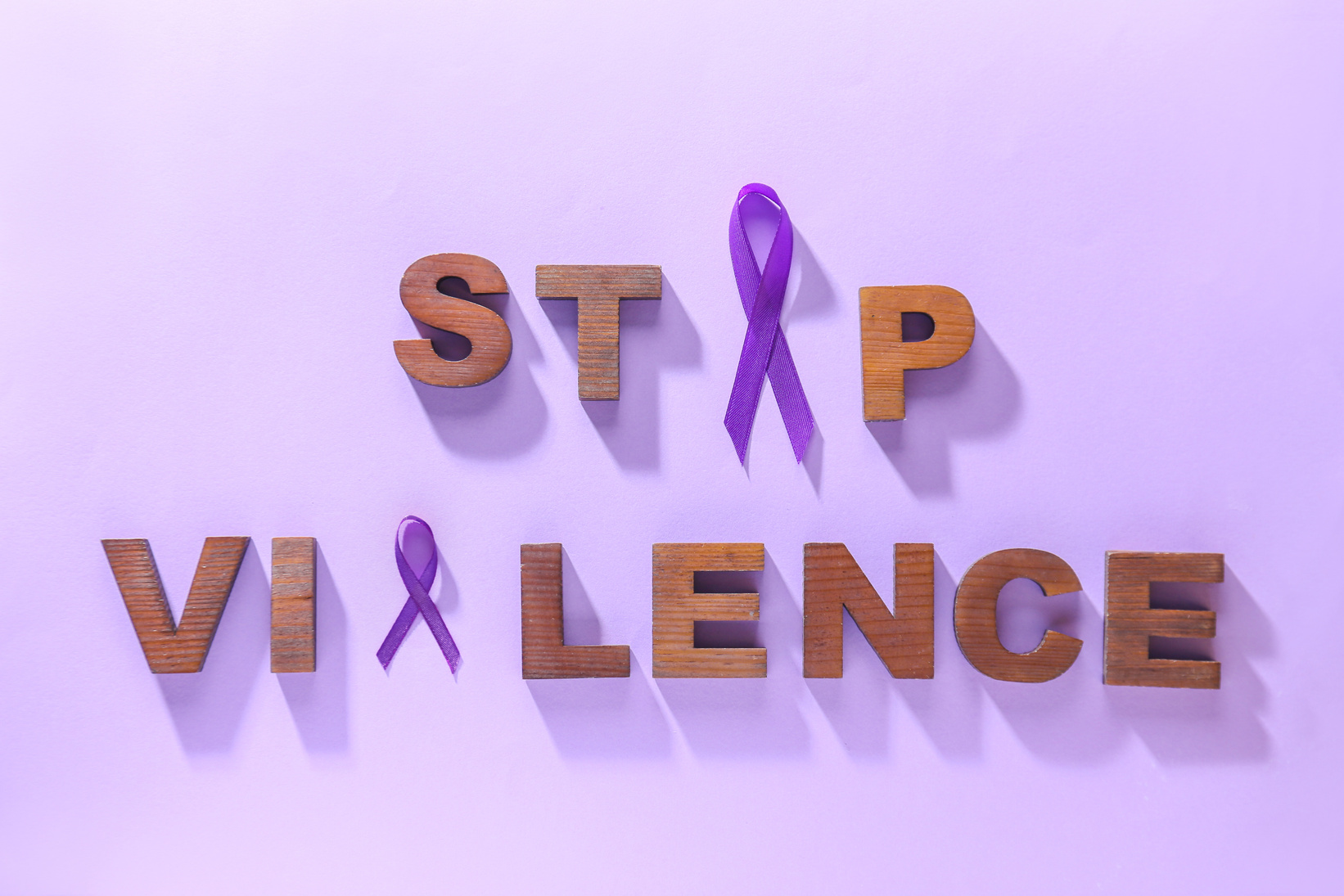 Violet Ribbons and Text DOMESTIC VIOLENCE 